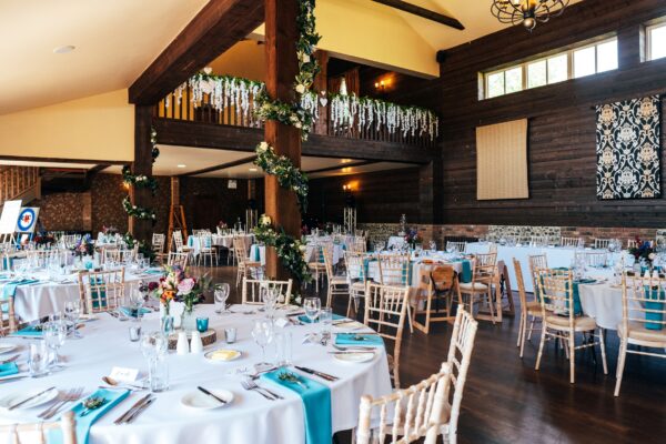 Jewelled tones, lawn games & axe throwing for this White Hart, Great Yeldham wedding. Best Essex Suffolk documentary wedding photographer