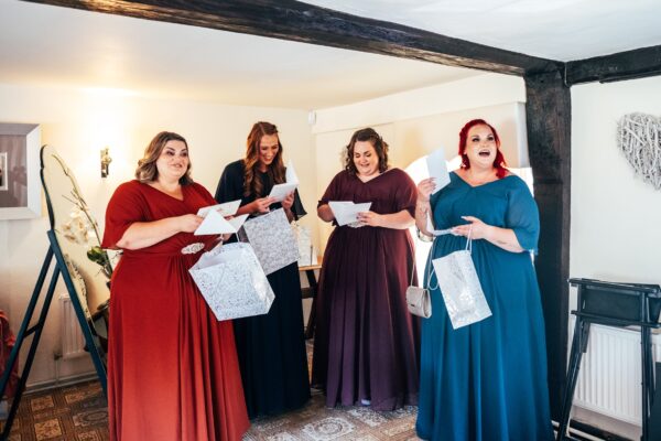 Jewelled tones, lawn games & axe throwing for this White Hart, Great Yeldham wedding. Best Essex Suffolk documentary wedding photographer