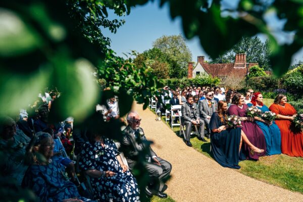 Jewelled tones, lawn games & axe throwing for this White Hart, Great Yeldham wedding. Best Essex Suffolk documentary wedding photographer