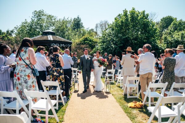 Jewelled tones, lawn games & axe throwing for this White Hart, Great Yeldham wedding. Best Essex Suffolk documentary wedding photographer