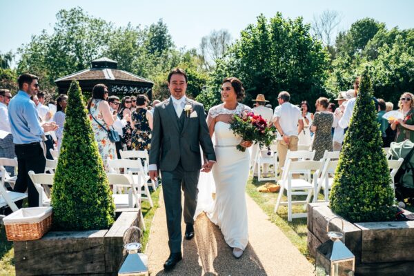 Jewelled tones, lawn games & axe throwing for this White Hart, Great Yeldham wedding. Best Essex Suffolk documentary wedding photographer