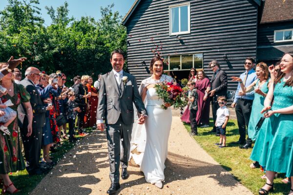 Jewelled tones, lawn games & axe throwing for this White Hart, Great Yeldham wedding. Best Essex Suffolk documentary wedding photographer