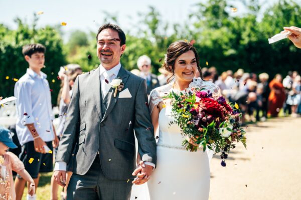 Jewelled tones, lawn games & axe throwing for this White Hart, Great Yeldham wedding. Best Essex Suffolk documentary wedding photographer