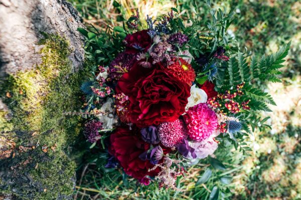 Jewelled tones, lawn games & axe throwing for this White Hart, Great Yeldham wedding. Best Essex Suffolk documentary wedding photographer