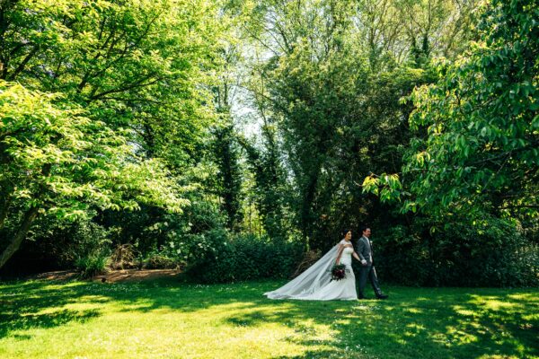 Jewelled tones, lawn games & axe throwing for this White Hart, Great Yeldham wedding. Best Essex Suffolk documentary wedding photographer