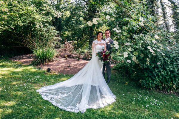 Jewelled tones, lawn games & axe throwing for this White Hart, Great Yeldham wedding. Best Essex Suffolk documentary wedding photographer