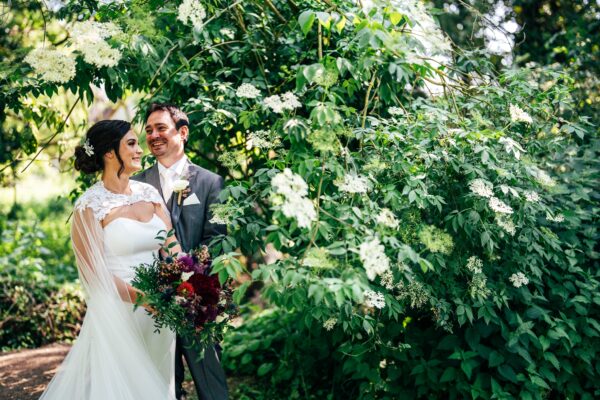 Jewelled tones, lawn games & axe throwing for this White Hart, Great Yeldham wedding. Best Essex Suffolk documentary wedding photographer