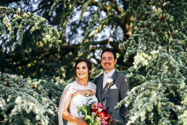 Jewelled tones, lawn games & axe throwing for this White Hart, Great Yeldham wedding. Best Essex Suffolk documentary wedding photographer