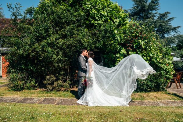 Jewelled tones, lawn games & axe throwing for this White Hart, Great Yeldham wedding. Best Essex Suffolk documentary wedding photographer