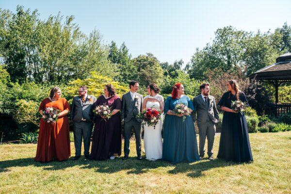 Jewelled tones, lawn games & axe throwing for this White Hart, Great Yeldham wedding. Best Essex Suffolk documentary wedding photographer