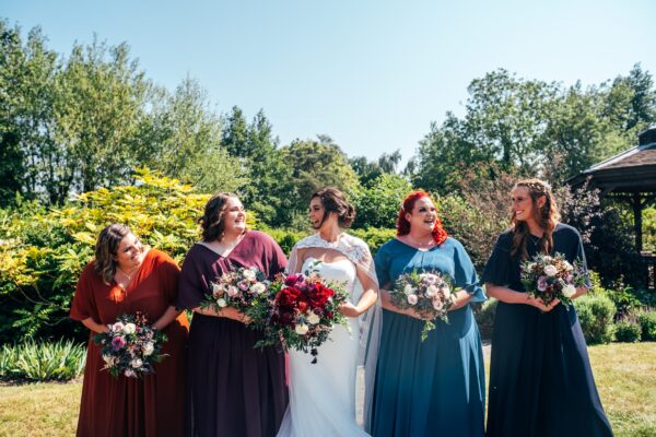 Jewelled tones, lawn games & axe throwing for this White Hart, Great Yeldham wedding. Best Essex Suffolk documentary wedding photographer