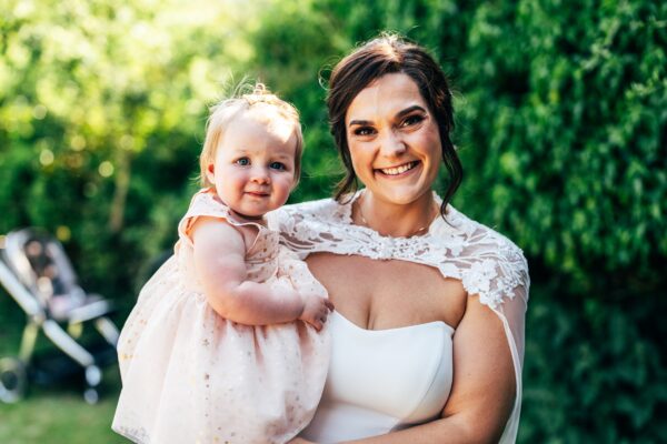 Jewelled tones, lawn games & axe throwing for this White Hart, Great Yeldham wedding. Best Essex Suffolk documentary wedding photographer