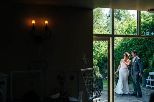 Jewelled tones, lawn games & axe throwing for this White Hart, Great Yeldham wedding. Best Essex Suffolk documentary wedding photographer