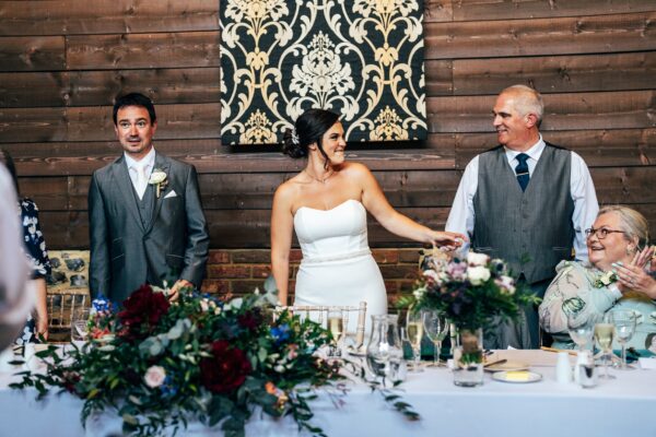 Jewelled tones, lawn games & axe throwing for this White Hart, Great Yeldham wedding. Best Essex Suffolk documentary wedding photographer