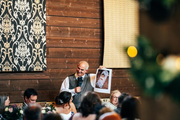 Jewelled tones, lawn games & axe throwing for this White Hart, Great Yeldham wedding. Best Essex Suffolk documentary wedding photographer