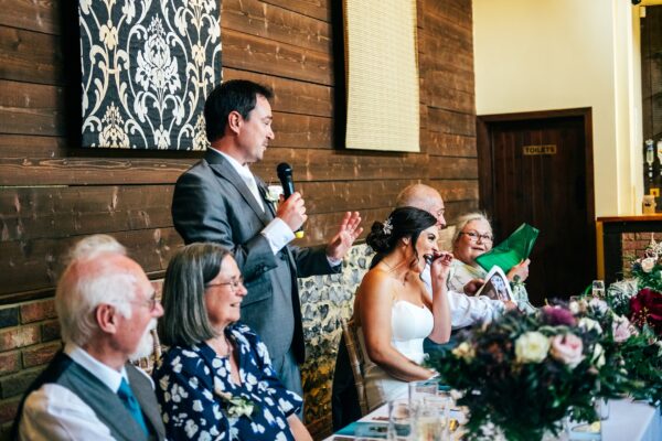 Jewelled tones, lawn games & axe throwing for this White Hart, Great Yeldham wedding. Best Essex Suffolk documentary wedding photographer