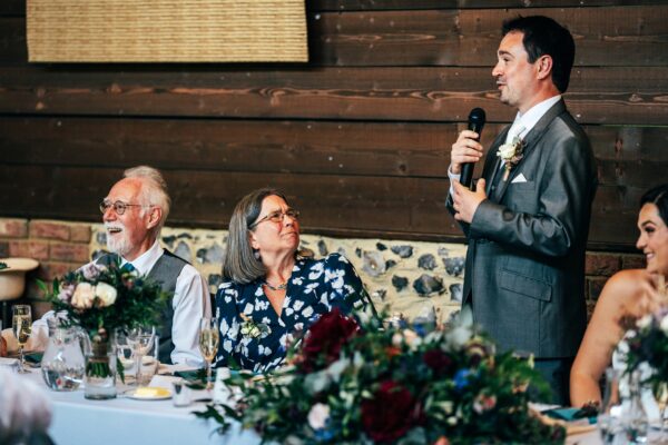 Jewelled tones, lawn games & axe throwing for this White Hart, Great Yeldham wedding. Best Essex Suffolk documentary wedding photographer