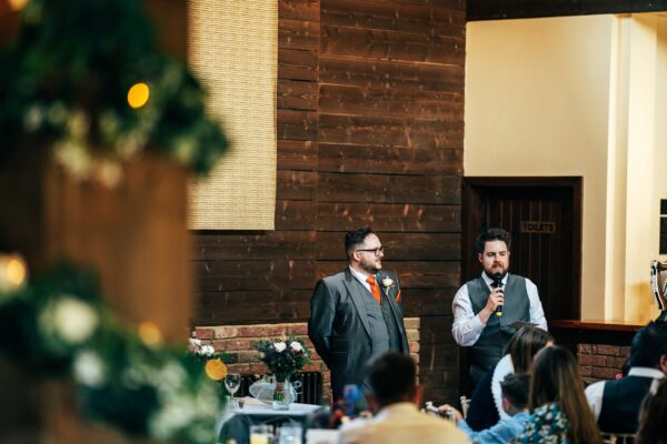 Jewelled tones, lawn games & axe throwing for this White Hart, Great Yeldham wedding. Best Essex Suffolk documentary wedding photographer