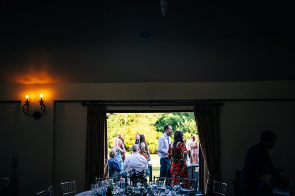 Jewelled tones, lawn games & axe throwing for this White Hart, Great Yeldham wedding. Best Essex Suffolk documentary wedding photographer