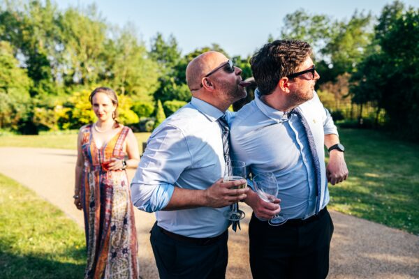 Jewelled tones, lawn games & axe throwing for this White Hart, Great Yeldham wedding. Best Essex Suffolk documentary wedding photographer