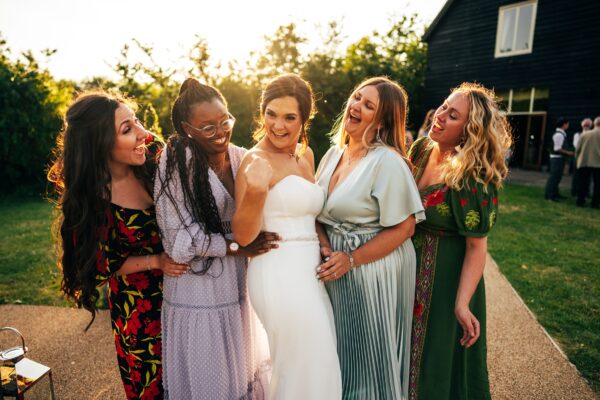 Jewelled tones, lawn games & axe throwing for this White Hart, Great Yeldham wedding. Best Essex Suffolk documentary wedding photographer