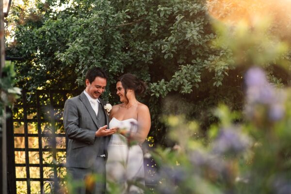 Jewelled tones, lawn games & axe throwing for this White Hart, Great Yeldham wedding. Best Essex Suffolk documentary wedding photographer