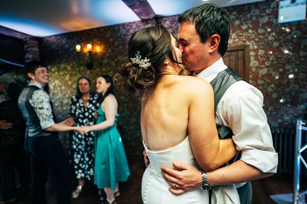 Jewelled tones, lawn games & axe throwing for this White Hart, Great Yeldham wedding. Best Essex Suffolk documentary wedding photographer