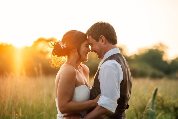 Jewelled tones, lawn games & axe throwing for this White Hart, Great Yeldham wedding. Best Essex Suffolk documentary wedding photographer