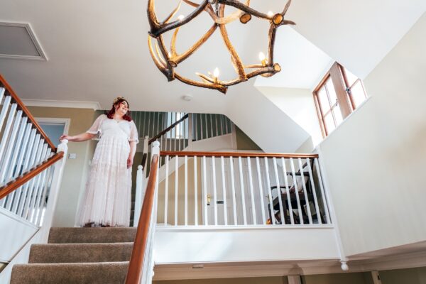 Spring pastels and a rainbow for an intimate wedding at Tuffon Hall Vineyard. Essex Documentary Wedding Photographer