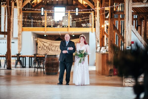 Spring pastels and a rainbow for an intimate wedding at Tuffon Hall Vineyard. Essex Documentary Wedding Photographer