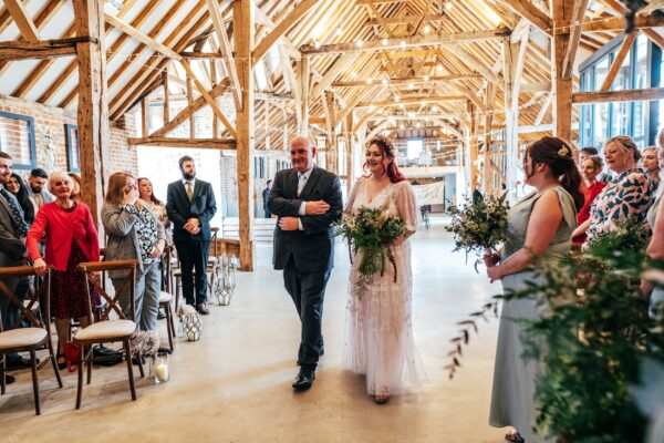 Spring pastels and a rainbow for an intimate wedding at Tuffon Hall Vineyard. Essex Documentary Wedding Photographer