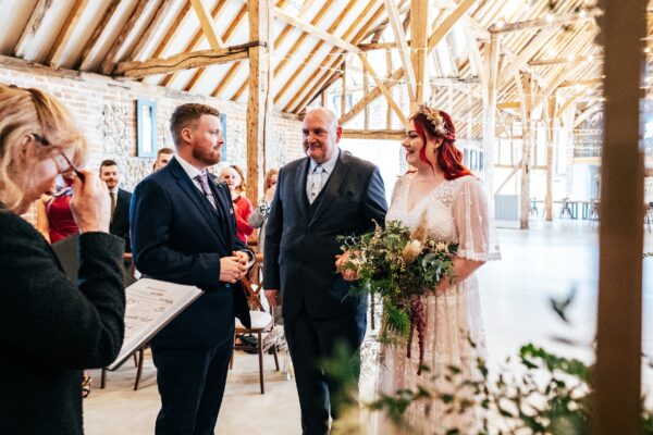 Spring pastels and a rainbow for an intimate wedding at Tuffon Hall Vineyard. Essex Documentary Wedding Photographer