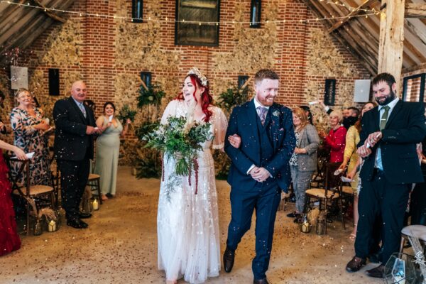 Spring pastels and a rainbow for an intimate wedding at Tuffon Hall Vineyard. Essex Documentary Wedding Photographer