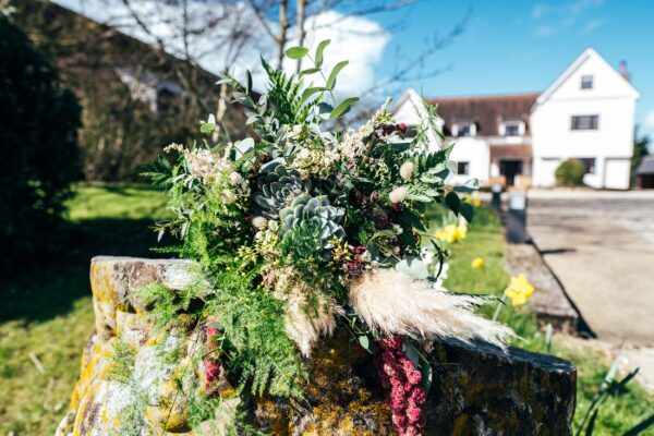 Spring pastels and a rainbow for an intimate wedding at Tuffon Hall Vineyard. Essex Documentary Wedding Photographer