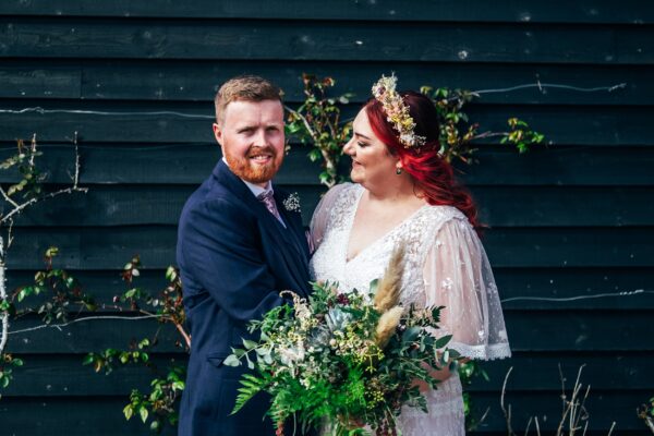 Spring pastels and a rainbow for an intimate wedding at Tuffon Hall Vineyard. Essex Documentary Wedding Photographer