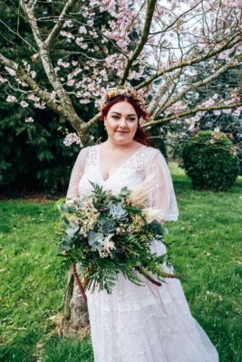 Spring pastels and a rainbow for an intimate wedding at Tuffon Hall Vineyard. Essex Documentary Wedding Photographer