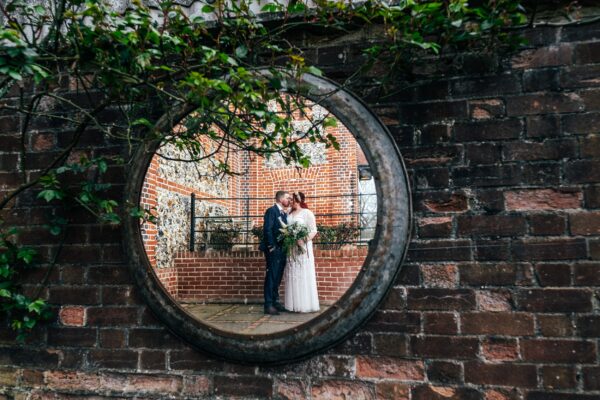 Spring pastels and a rainbow for an intimate wedding at Tuffon Hall Vineyard. Essex Documentary Wedding Photographer