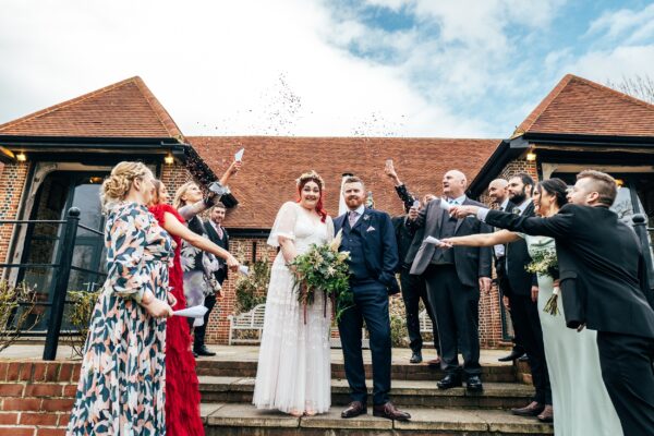 Spring pastels and a rainbow for an intimate wedding at Tuffon Hall Vineyard. Essex Documentary Wedding Photographer