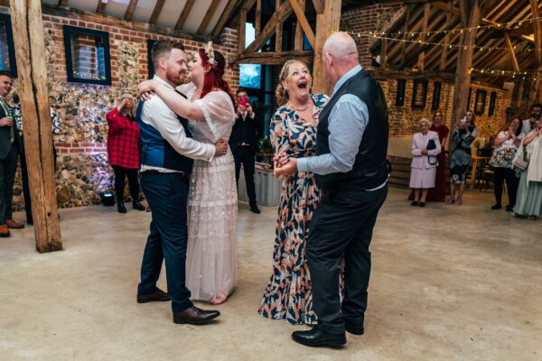 Spring pastels and a rainbow for an intimate wedding at Tuffon Hall Vineyard. Essex Documentary Wedding Photographer