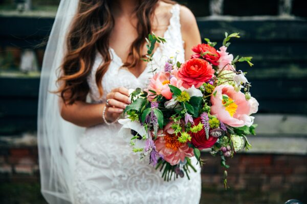 Spring brights & black tie for rustic glamour at The Barns at Lodge Farm. Essex documentary wedding photographer