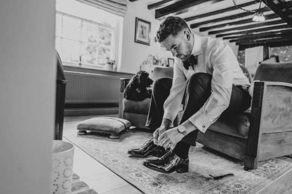 Impossibly chic, black tie wedding at The Hare's Field, with Bridesmaids in mismatched pinks and dried flowers. Best Essex Documentary Wedding Photographer