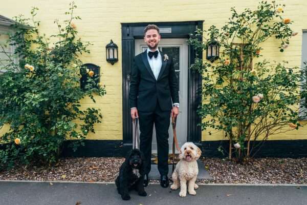 Impossibly chic, black tie wedding at The Hare's Field, with Bridesmaids in mismatched pinks and dried flowers. Best Essex Documentary Wedding Photographer