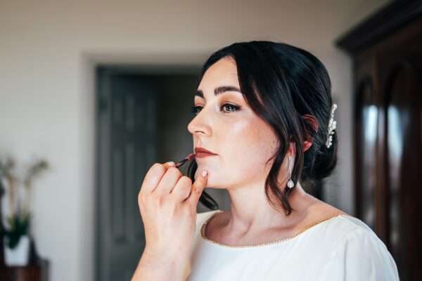 Impossibly chic, black tie wedding at The Hare's Field, with Bridesmaids in mismatched pinks and dried flowers. Best Essex Documentary Wedding Photographer