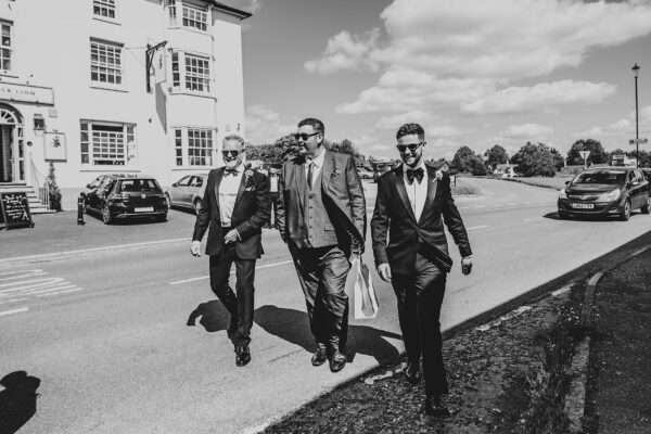 Impossibly chic, black tie wedding at The Hare's Field, with Bridesmaids in mismatched pinks and dried flowers. Best Essex Documentary Wedding Photographer