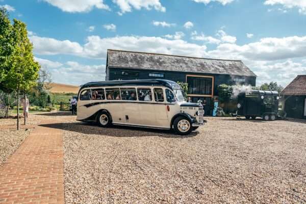 Impossibly chic, black tie wedding at The Hare's Field, with Bridesmaids in mismatched pinks and dried flowers. Best Essex Documentary Wedding Photographer