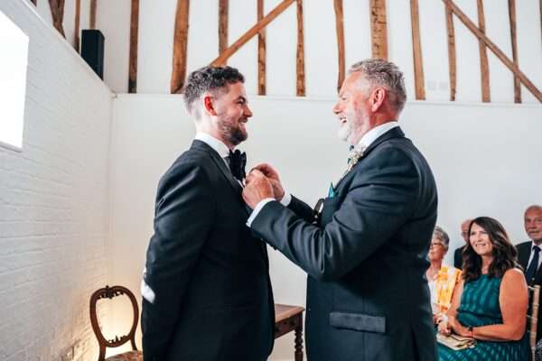 Impossibly chic, black tie wedding at The Hare's Field, with Bridesmaids in mismatched pinks and dried flowers. Best Essex Documentary Wedding Photographer