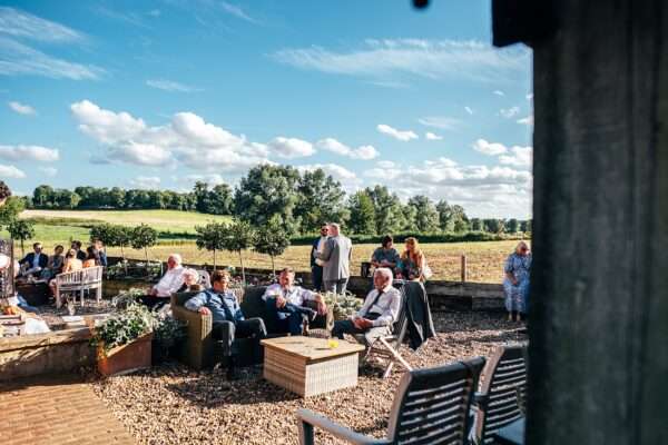 Impossibly chic, black tie wedding at The Hare's Field, with Bridesmaids in mismatched pinks and dried flowers. Best Essex Documentary Wedding Photographer