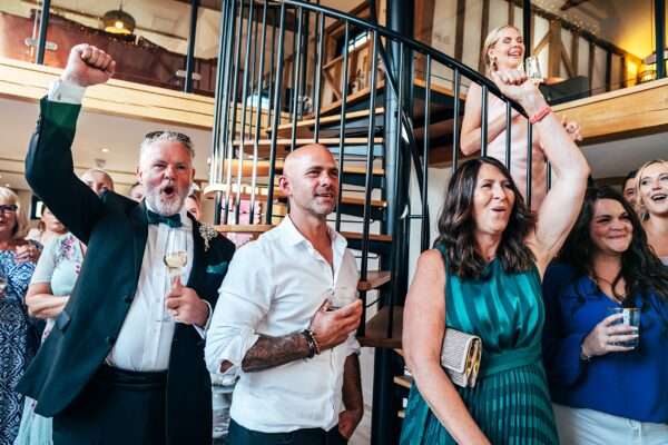 Impossibly chic, black tie wedding at The Hare's Field, with Bridesmaids in mismatched pinks and dried flowers. Best Essex Documentary Wedding Photographer