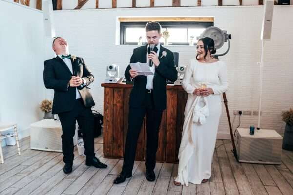 Impossibly chic, black tie wedding at The Hare's Field, with Bridesmaids in mismatched pinks and dried flowers. Best Essex Documentary Wedding Photographer