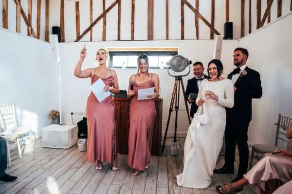 Impossibly chic, black tie wedding at The Hare's Field, with Bridesmaids in mismatched pinks and dried flowers. Best Essex Documentary Wedding Photographer